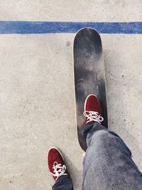 Low section of person standing on skateboard