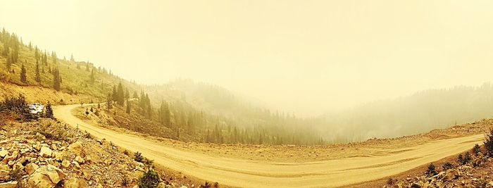 Panoramic view of road on mountain against sky