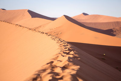 Scenic view of desert against clear sky