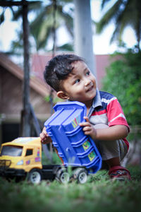 Portrait of cute boy with toy