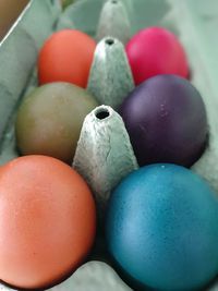 High angle view of multi colored eggs