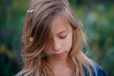 Close-up of young woman looking away