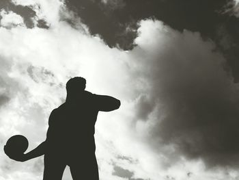 Low angle view of statue against cloudy sky