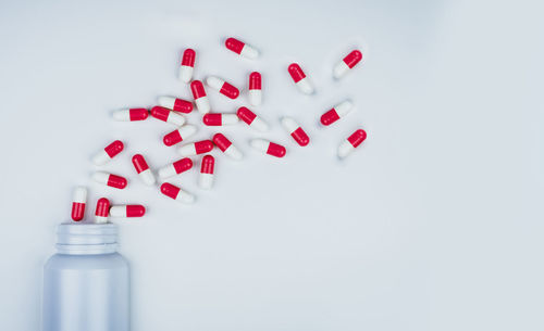 Close-up of bottles over white background