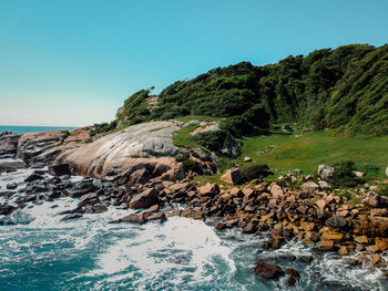 Scenic view of sea against clear blue sky