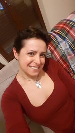 Portrait of smiling woman at home
