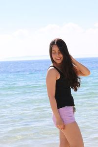 Close-up of woman standing at beach