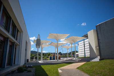 Panoramic view of buildings against blue sky