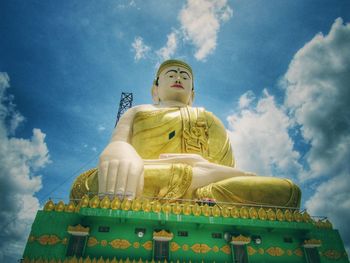 Low angle view of statue against sky