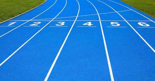 High angle view of numbers on blue running track