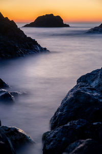 Scenic view of sea against sky during sunset