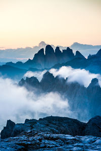 Scenic view of mountains against sky during sunset