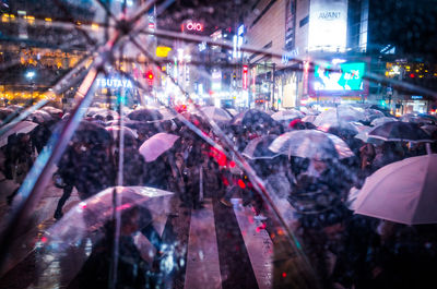 Crowd on city street at night