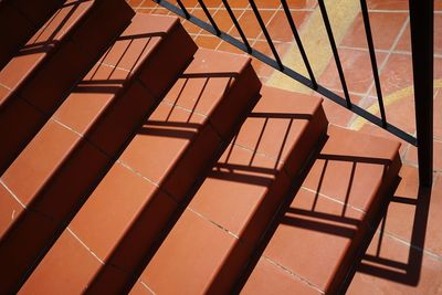 High angle view of empty chairs against building