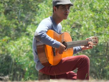 Young man playing guitar