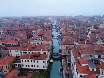 High angle view of buildings in city against sky