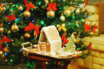 Close-up gingerbread cookies against christmas tree