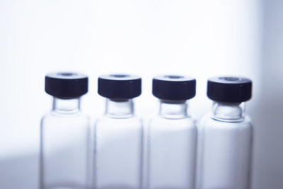 Close-up of bottles against white background