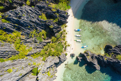 High angle view of rocks by sea