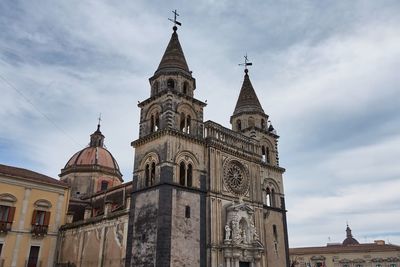 Low angle view of cathedral against cloudy sky