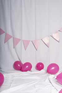 Heart shape on bed against wall at home