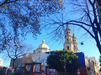 Low angle view of church against blue sky