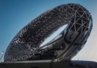 Low angle view of metallic structure against clear blue sky