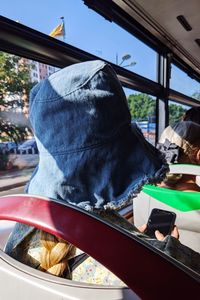 Rear view of man traveling in bus