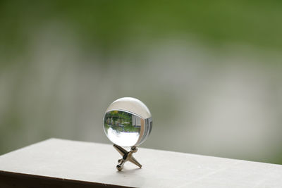 Close-up of crystal ball on table