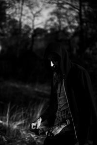 Midsection of man wearing hat