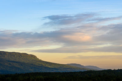 Scenic view of silhouette mountains against sky during sunset