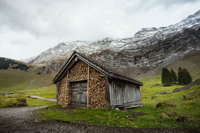 Built structure on mountain against sky