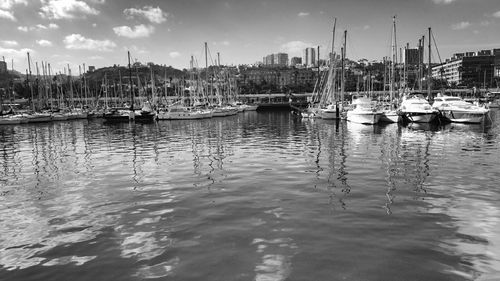 Boats moored at harbor