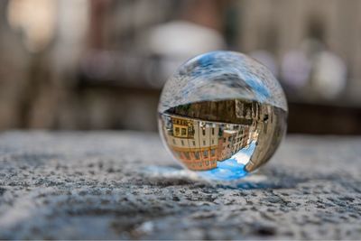 Close-up of crystal ball on footpath