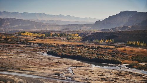 Landscape with mountain range in the background