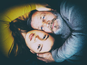 Directly above portrait of senior man with granddaughter