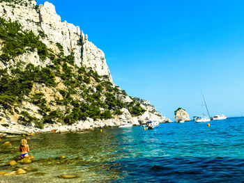 Scenic view of sea against clear blue sky