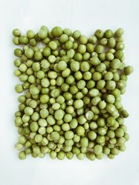 High angle view of chopped tomatoes against white background