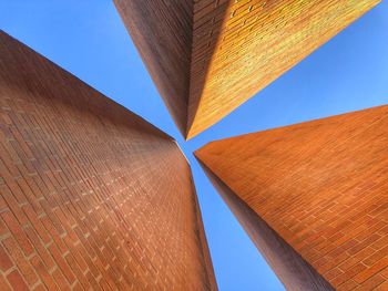 Low angle view of building against clear blue sky