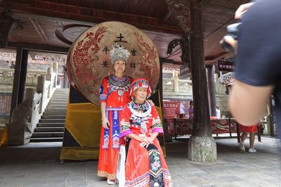 Rear view of people in traditional clothing