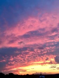 Low angle view of dramatic sky during sunset