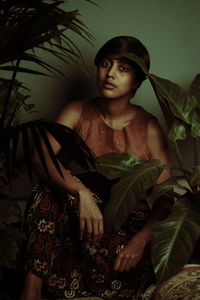 Portrait of a young woman sitting outdoors