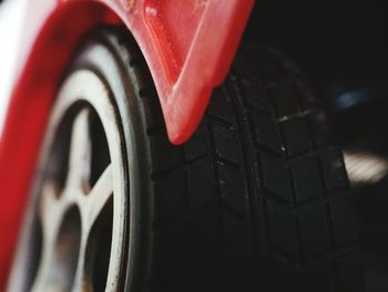 Close-up of red tire on car