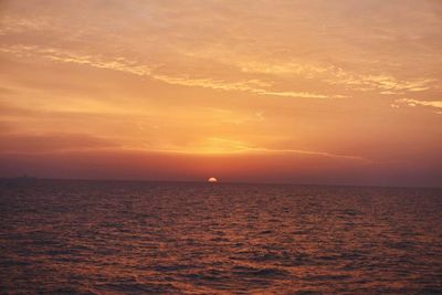 Scenic view of sea against romantic sky