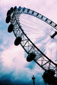 Low angle view of ferris wheel against sky