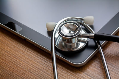 Close-up of stethoscope on digital tablet