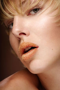 Close-up portrait of woman wearing lipstick