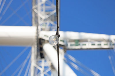 Close-up of sailboat against blue sky