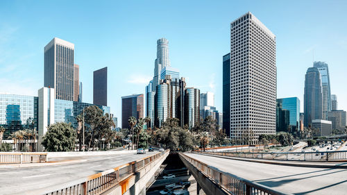 Modern buildings in city against clear sky