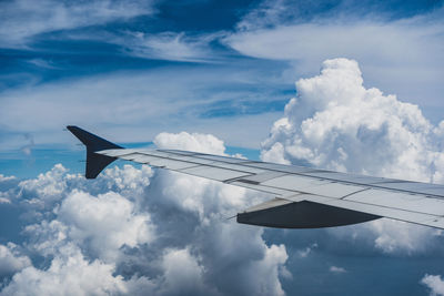 Low angle view of airplane flying in sky